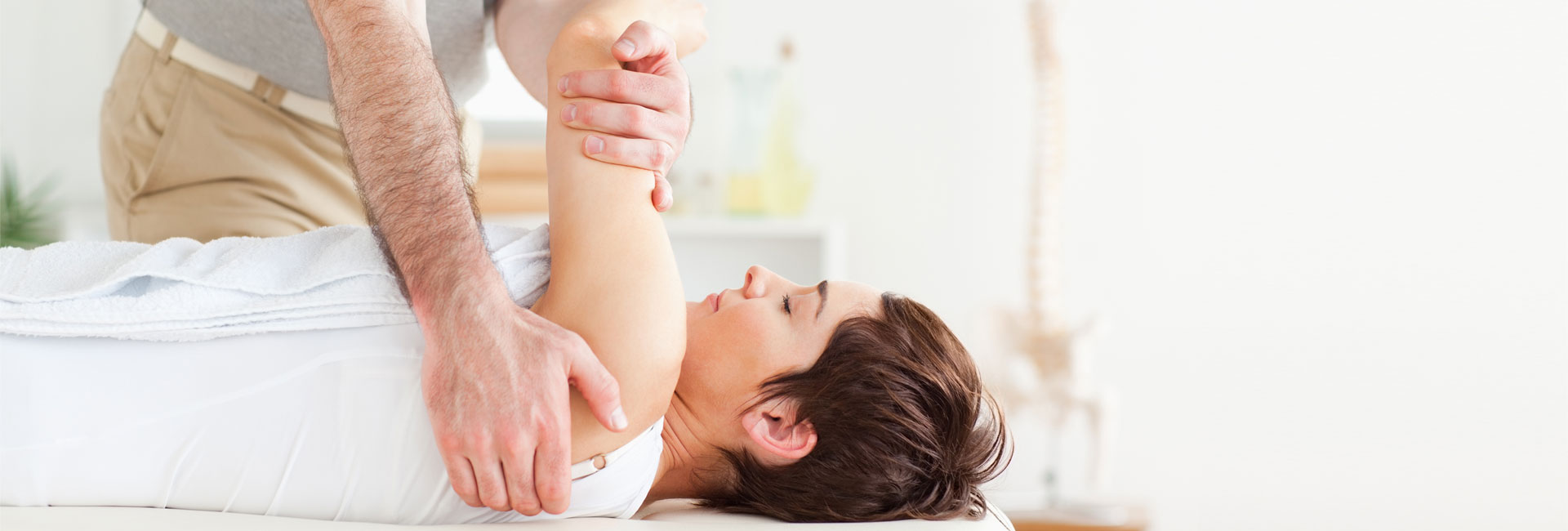 Man Performing Physical Therapy on a Woman